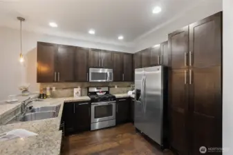 Well-appointed kitchen with stainless appliances and generous storage.