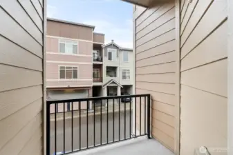 Private balcony overlooking the community—perfect for morning coffee.