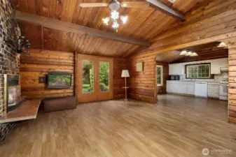 French doors to a patio and expansive back yard...