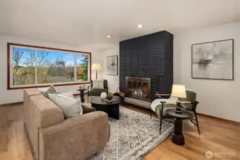Upstairs living room with oversized picture window and Cascade mountain views.
