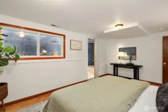 Large downstairs bedroom showing access to shop/fitness/storage room.