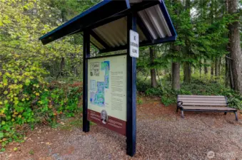 Community trail head sign.  There are seating benches throughout the trail that leads to community rocky beach.