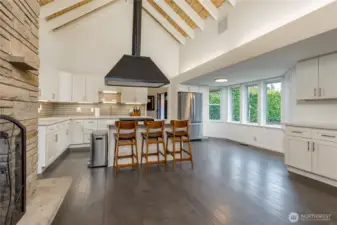 Expansive kitchen boasts cathedral ceilings