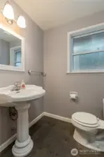 Half bathroom on the main floor, right by the garage entry