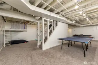 A rec room paradise: The fully-finished basement features a custom play loft, bouldering wall, and plenty of space for games