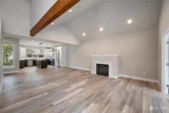 Large Great Room Concept with Gas Fireplace and Vaulted Ceilings.