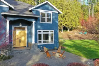 Back outside, a patio area is adjacent to the front door