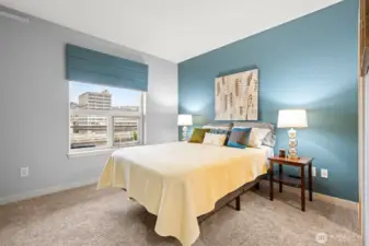 The bedroom is shown here with a queen size bed, but easily accommodates king size. The window here, and one in the living room, can be opened for fresh air. Or turn on the central AC for warm days ahead.