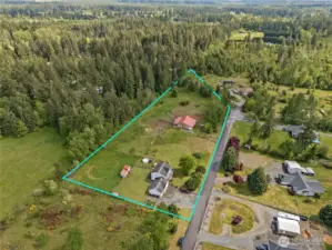 Your countryside dream: 5 scenic acres with a homestead, barn, and all the space your horses or hobbies need.