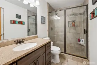 A charming hall bath with a classic look and a beautifully tiled shower for everyday ease.