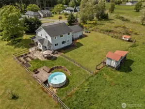 The immediate homestead area offers outdoor living at its best with a pool, deck, fenced yard, garden beds, and terrace all just steps from the home.