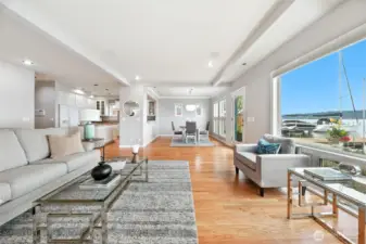 This home was thoughtfully designed with an open floor plan featuring high ceilings, walls of view windows overlooking Lake Washington, and newly refinished hardwood floors.