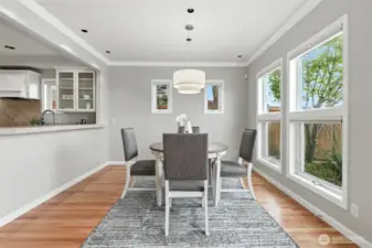 The dining room is conveniently located off of the kitchen and living areas with a glass French door that leads out to the entertainment sized patio and waterfront.