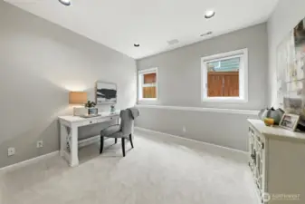 The main floor houses a den/office that can also be used for a fourth bedroom with the three-quarter bath just steps away.
