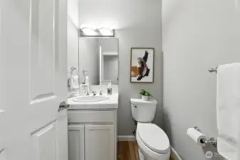 Half bath on the main floor is just a few steps from the shower that is located in the laundry room making it easy to shower off after a fun day out on the lake.