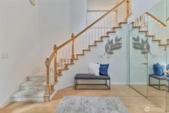 Attractive staircase with under banister accent lights.