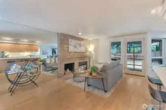 Also off the kitchen in this cozy sitting area where you can relax by the gas fireplace.
