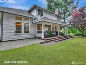 The backyard also has a patio area that would be perfect for an outdoor table and a grill.