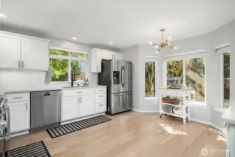 Updated kitchen and bathrooms with modern finishes, quartz counters and light fixtures.