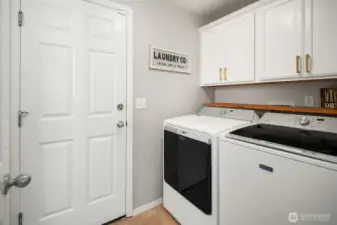 Maytag Washer and Dryer with upper cabinets to stay organized.