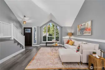 Enter into a spacious, vaulted ceiling living room.