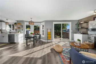 From the open concept kitchen/ family room, exit to a level back yard.