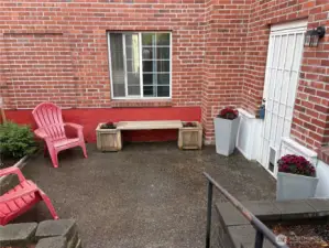 Private patio features large space w/raised beds is fenced & gated