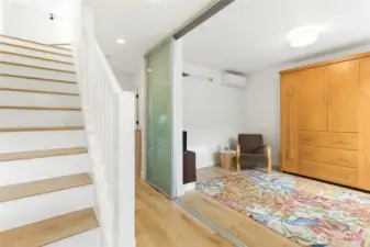 Upon entry you'll see the third bedroom with Murphy bed which has a sliding glass door for privacy.