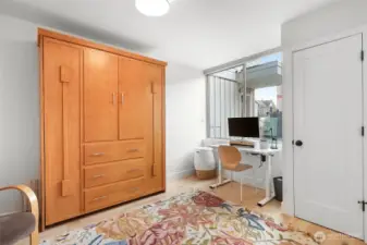 This room makes a cheerful office with loads of closet space.