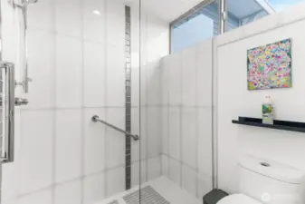 Primary bath features sleek and updated finishes.