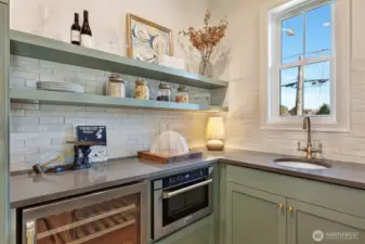 Butlet's pantry includes wine cooler, drawer microwave, wet bar sink and loads of extra cabinet storage & shelving.