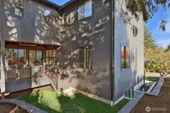 Covered deck with heat overhead includes stairs down to backyard.