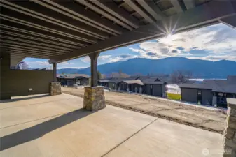 Spacious covered patio outside the living room lets you enjoy the outdoors any time of year. Pre-wired for ceiling patio heaters and pre-wired for your private hot tub addition.