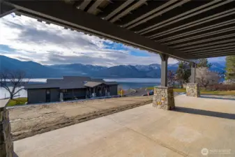 Covered patio extends from the living room area to in front of the primary bedroom.
