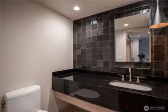 Stylish and modern half-bath in the entry area.