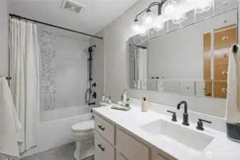 Full bath off main hallway, upper level.