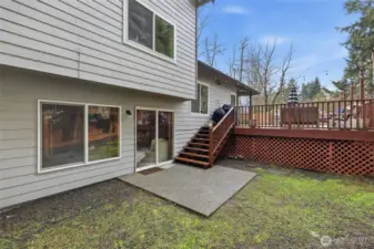 A portion of back yard area and deck ...