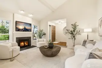 The living room is ideal for gatherings or cozy evenings by the fireplace.