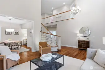 Elegant two-story entry with spiral staircase open to the formal rooms below