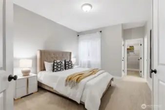 Versatile main floor suite with walk-in closet and en-suite bathroom.