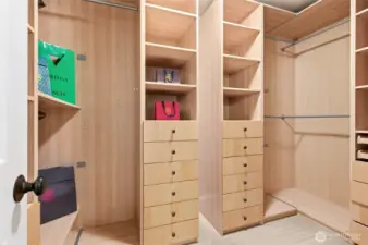 Primary suite walk-in closet w/ custom built-ins to maximize storage.