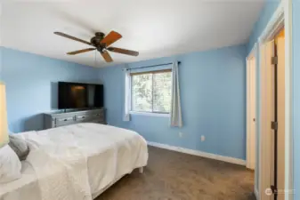 Primary bedroom overlooks the backyard. Walk-in closet to your right along with private bath.