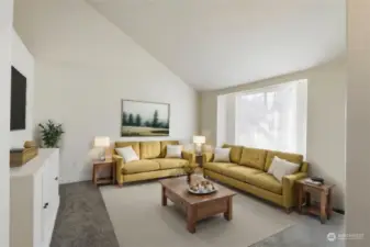 Main living room greets you as you enter. Full of natural light and soaring ceilings. (Virtually staged)