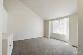 Main living area is filled with natural light. Plush new carpet and fresh interior paint.