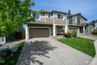 Attached two car garage with ample driveway parking.