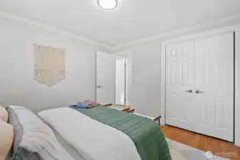 The third bedroom boasts a sleek closet system and offers primary-suite-sized space. Plus, as a bonus, who doesn’t love the added charm of crown molding?