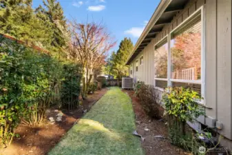 With gates on each side and an abundance of gorgeous plants, the yard is both private and beautiful. Plus, the efficient heat pump ensures year-round comfort, making this home a standout in energy savings!