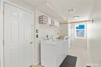 Large laundry room w/ door to garage.