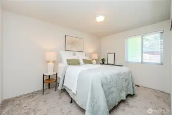 Bedroom #2 is the largest of the 3 Bedrooms with a closet to the right of the window and a door to the hall (Full) Bathroom on the left.