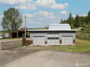 3 car/bays in front with another side bay for storage or equipment